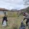 two volunteers cleaning the area